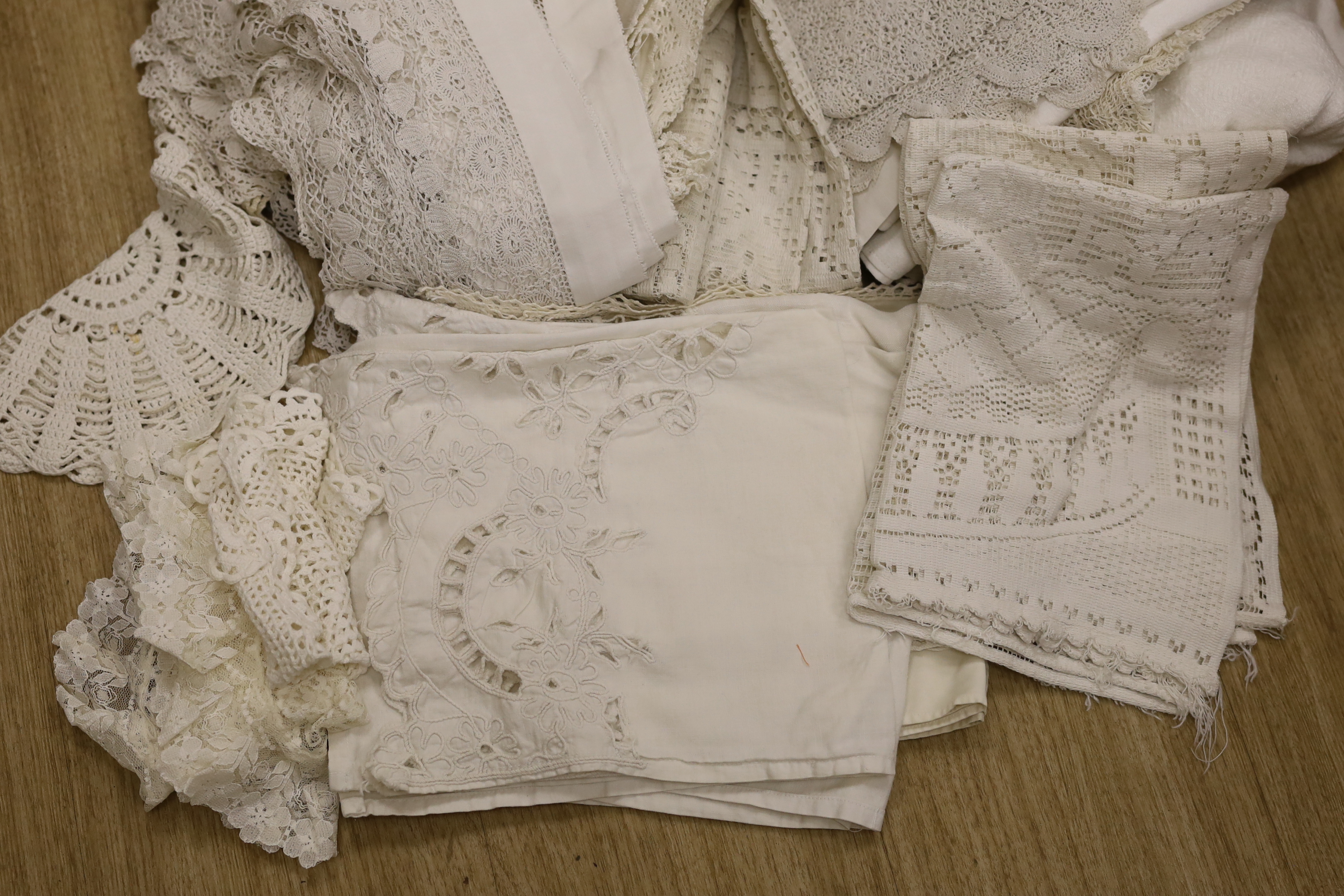 A collection of mixed crochet and embroidered linens